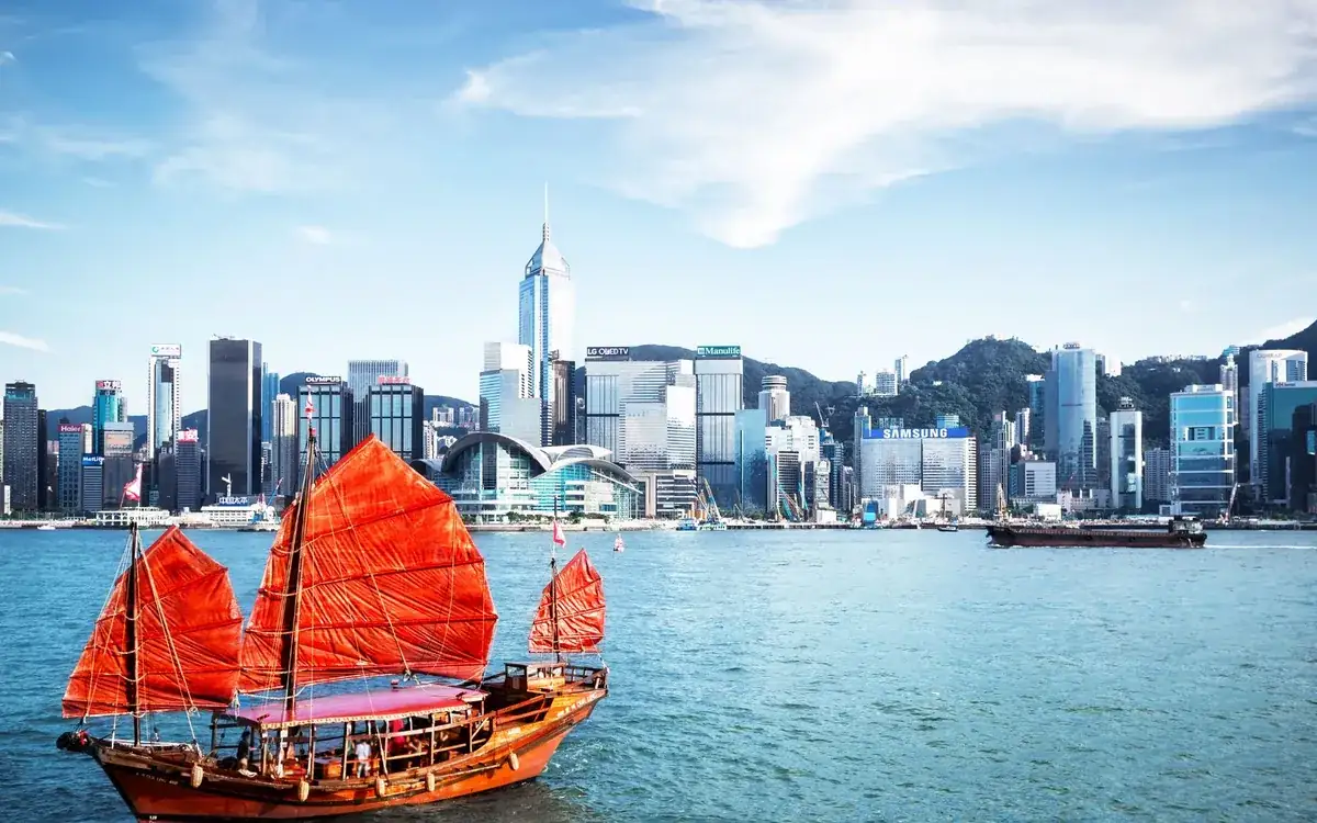 Victoria Harbour with a red sail boat